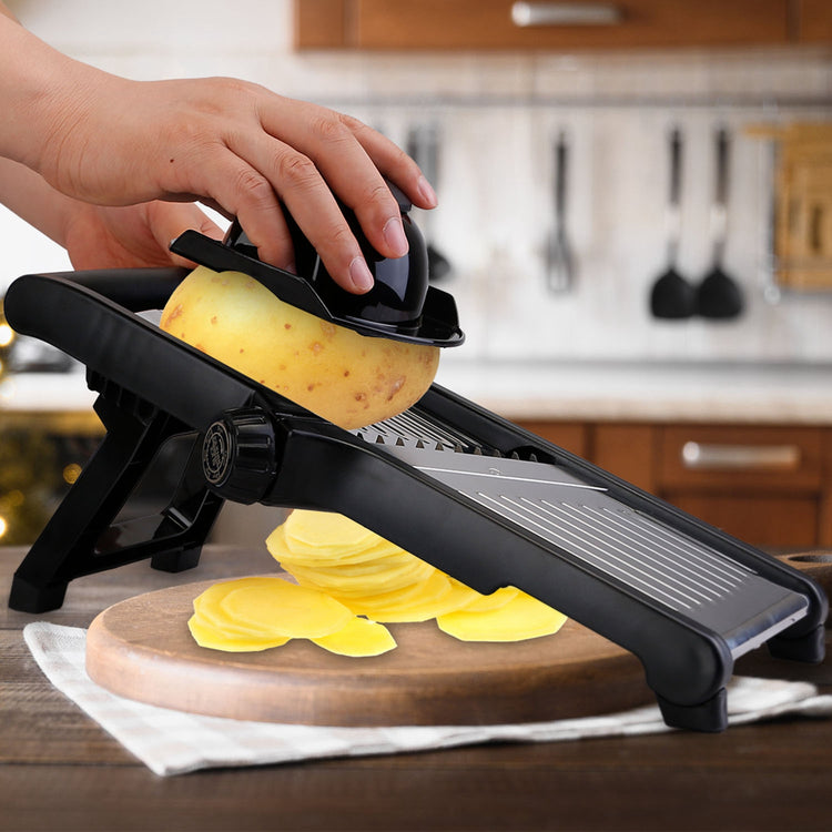 Stainless steel mandoline slicer with food holder for vegetables